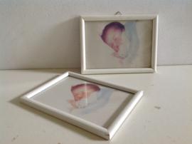 Wanddecoratie. Baby slapend.