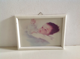 Wanddecoratie. Baby wakker.