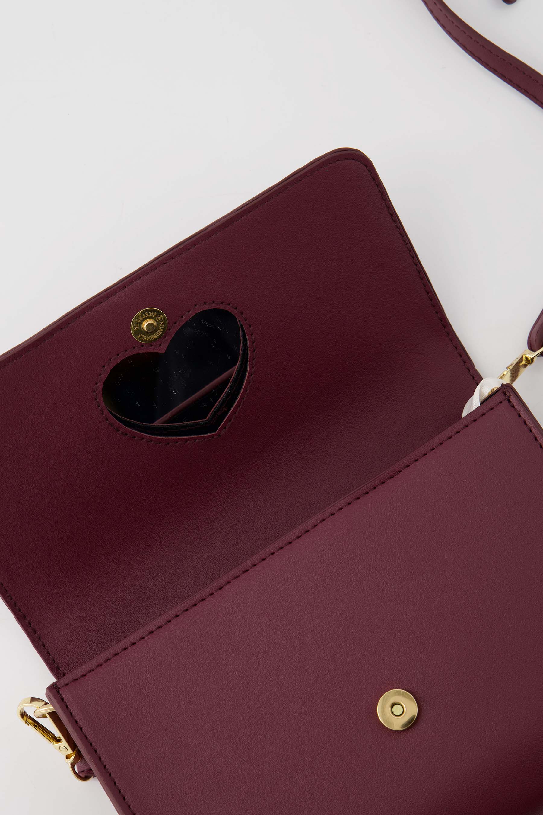 clutch met hart spiegel aubergine