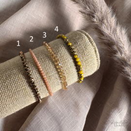 Sprankelende kralen armbandjes geel/bruin