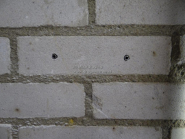 Hoe weet ik of de muur droogt?