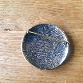 Keltische fibula met drie paarden