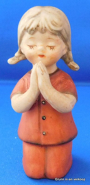 Porseleinen Capodimonte biddend meisje