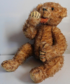 Oude brocante duim zuigende teddybeer