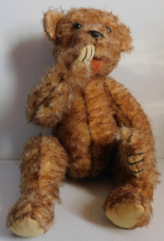 Oude brocante duim zuigende teddybeer