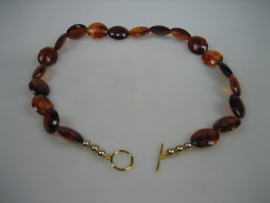 Amber ovaal exclusief collier met kapittelstokje en gouden balletjes