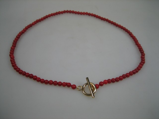Antiek bloedkoraal collier met gouden kapittelstokje uit ca. 1890