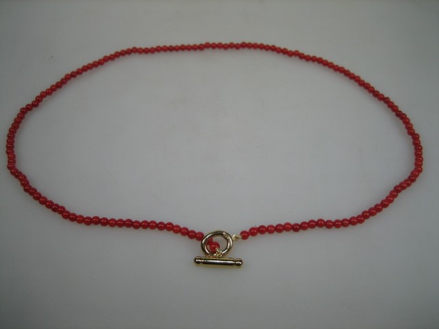 Antiek bloedkoraal collier met gouden kapittelstokje uit ca. 1890