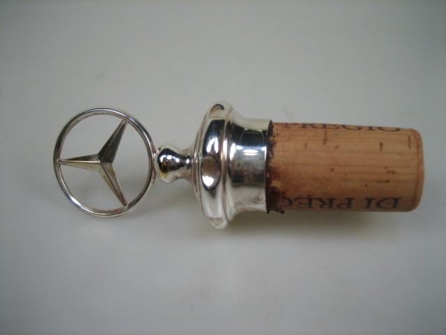 Zilveren oude Wijn dop met Mercedes embleem uit ca. 1930