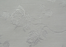 Jacquard coutill  wit met witte roos 142 cm breed. (prijs per 50 cm.)