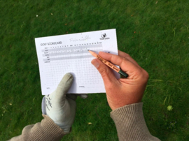 Golf bloeipotlood en scorecard