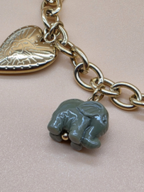 Armband met zon, bloem, olifant, hart, gegraveerde vogel, klaver