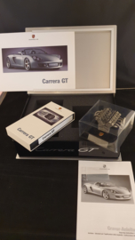 Porsche Carrera GT owners box with engine block sculpture, brochure and video