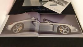 Porsche Carrera GT owners box with engine block sculpture, brochure and video