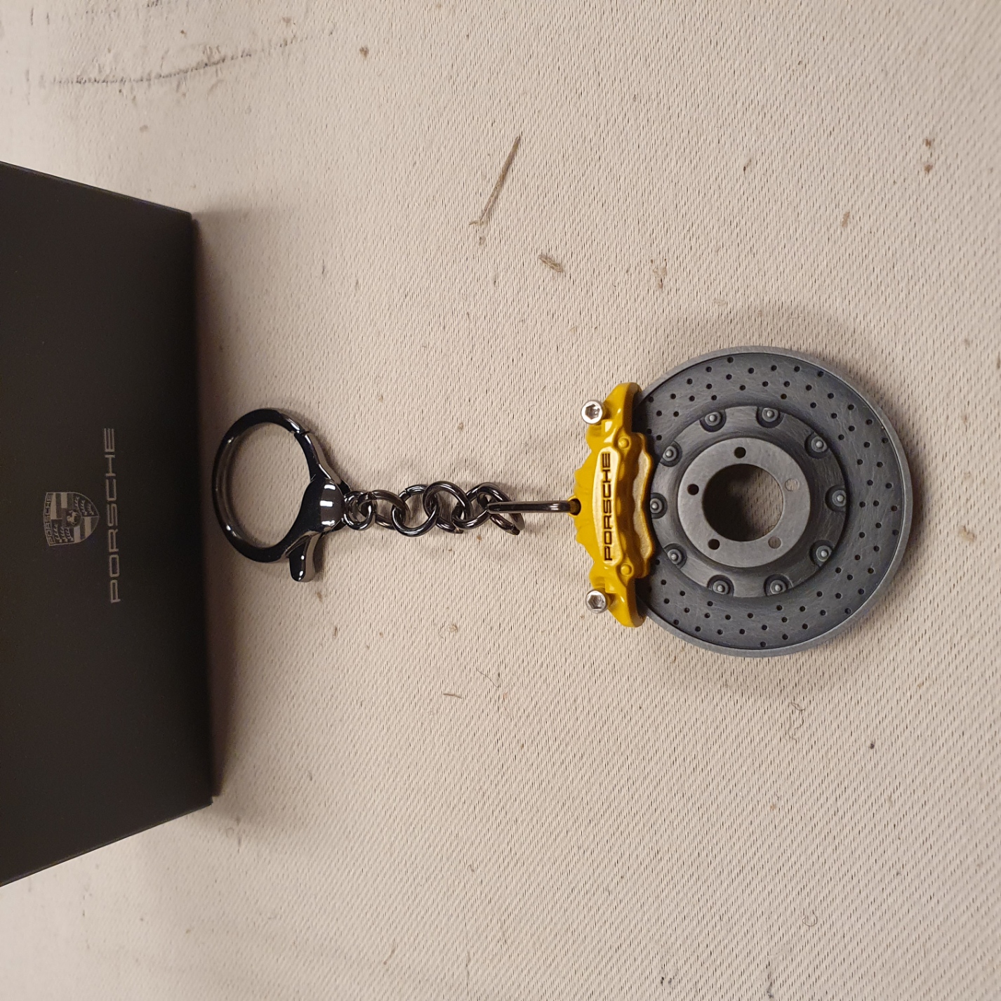 Porsche brake disc keychain with yellow caliper - WAP0503700PSAB