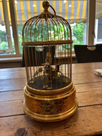 Reuge singing birds in kooi - bemiddeling