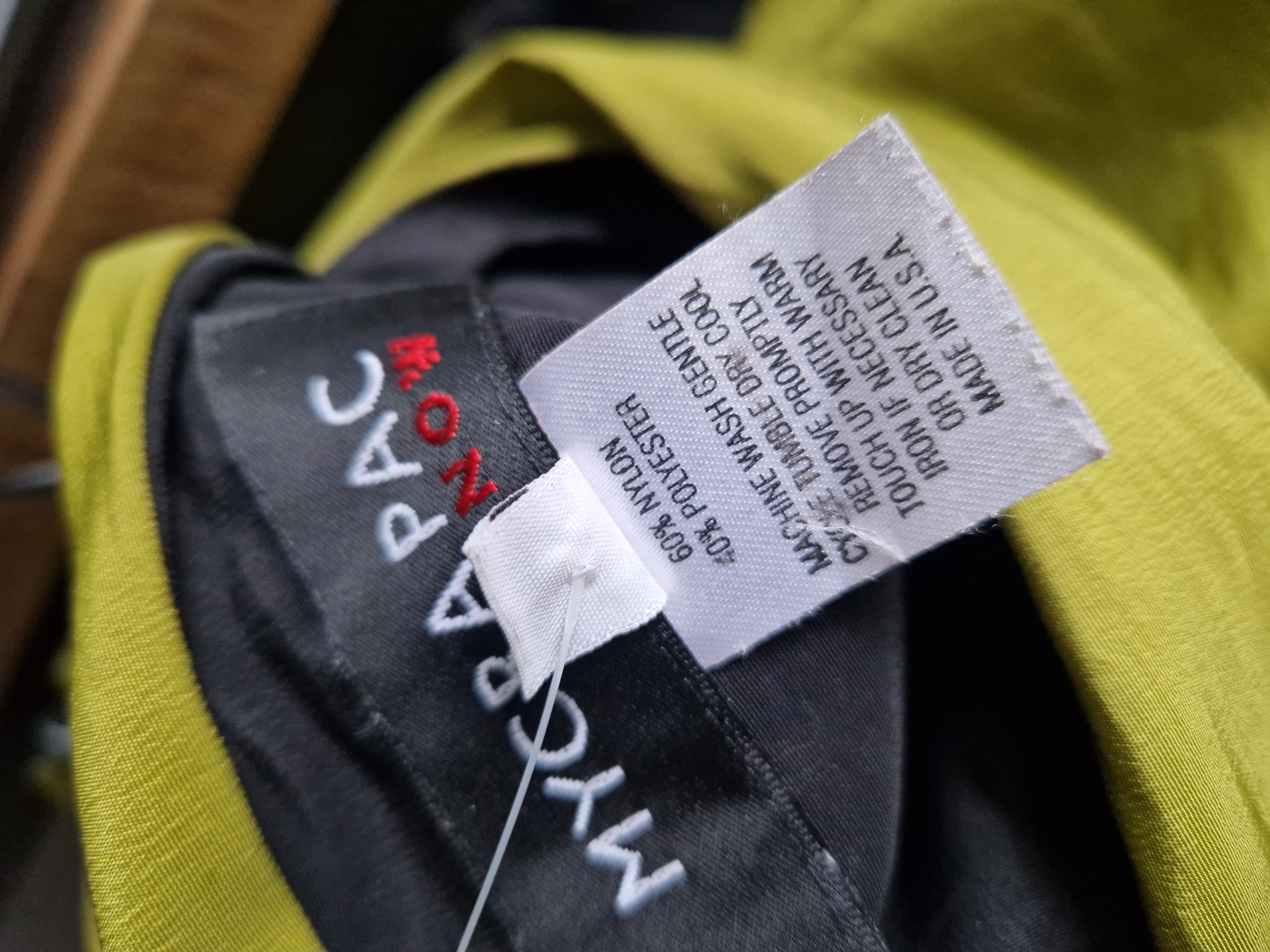 Mycra Pac reversibel regenjas. Maat M. Zwart/limegroen.