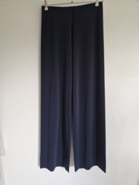 Humanoid pantalon met wijde pijpen. Maat M. Donkerblauw