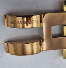 Michael Kors schakelarmband.Stainless steel. Rosé/goud.