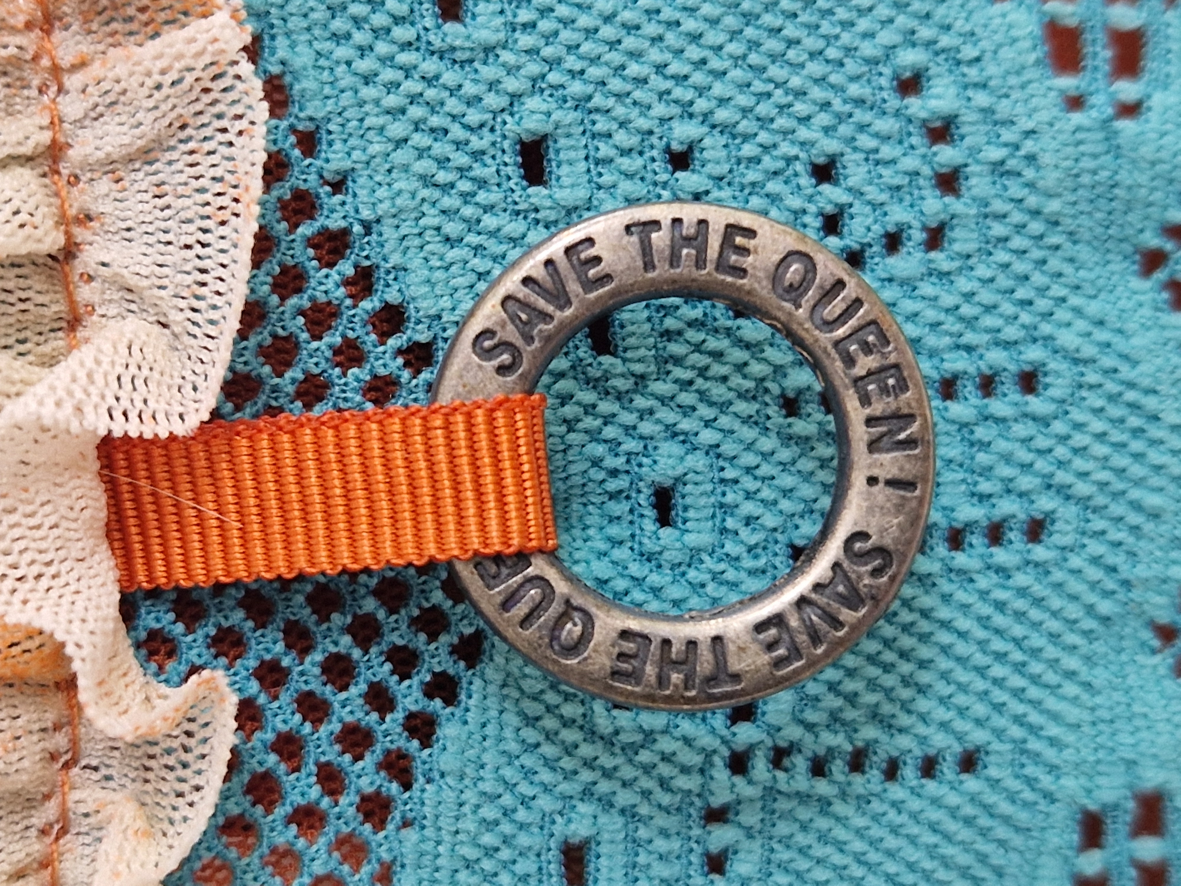 Save the Queen top. Maat M. Turquoise/print.