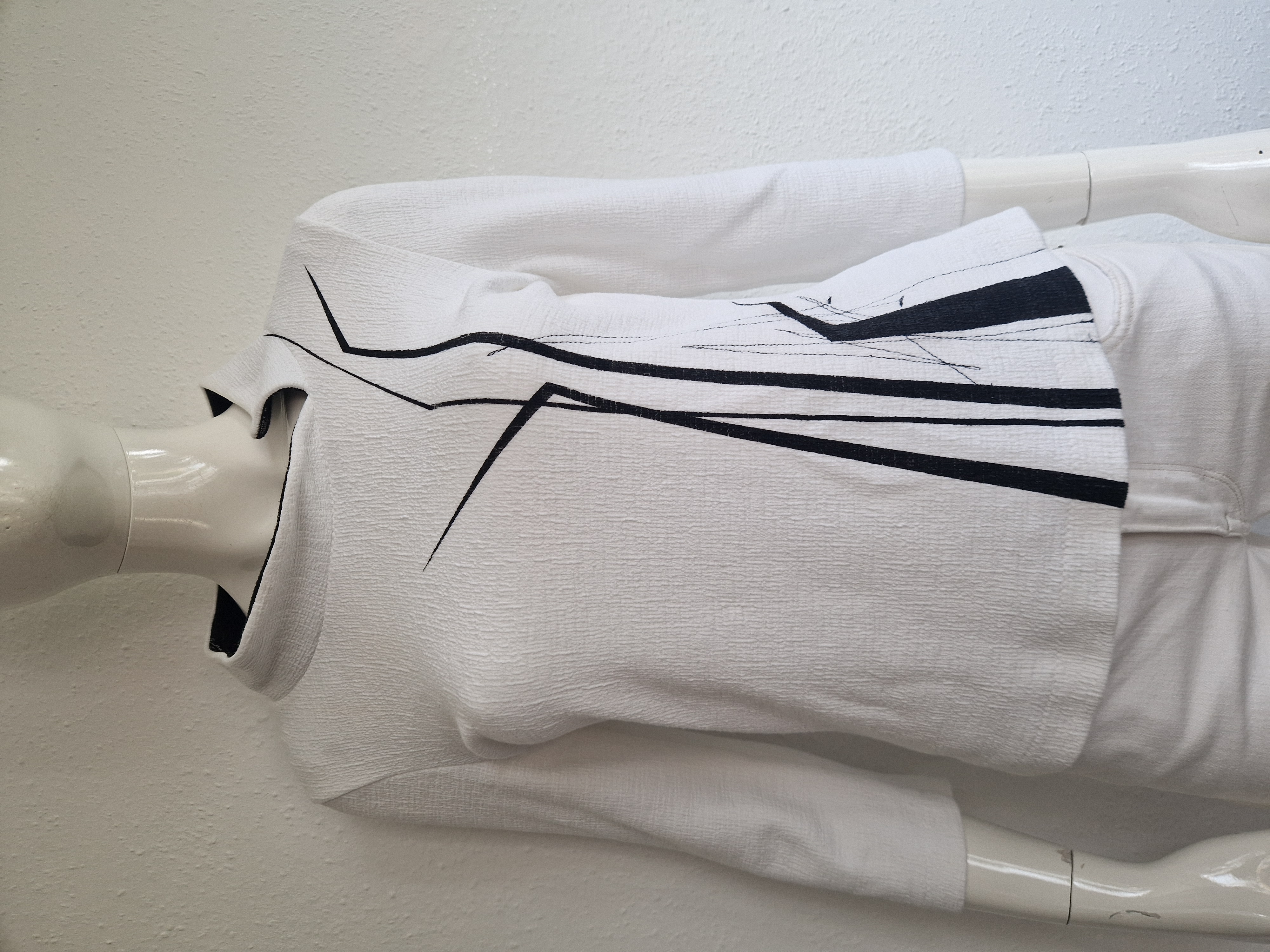 Irma Borgsteede top. Maat M. Wit/grafische print.