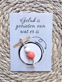 Geluk is genieten van wat er is + gelukspop ORANJE