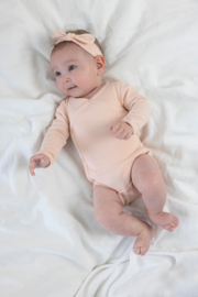 Feetje newborn wikkelromper roze