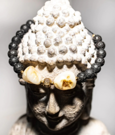 Heavy shell stone, held together by little Buddha