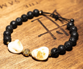 Heavy shell stone, held together by little Buddha