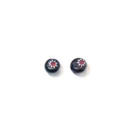 Black glass bead with star in red/white