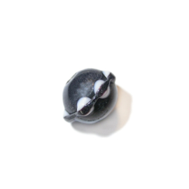 Black glass bead with a collar with white dots
