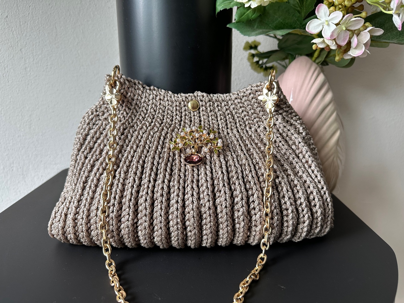 Bag with a brooch in beige
