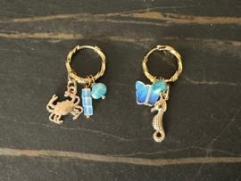oorbellen/creolen rvs goud met opaliet licht blauw