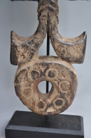 Nepalese ghurra – churning stick holder with cosmic symbolism