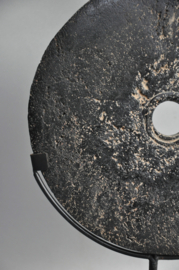 Stone currency on stand, SUMBA, Indonesia, 21st century