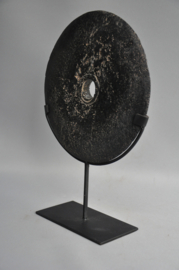 Stone currency on stand, SUMBA, Indonesia, 21st century