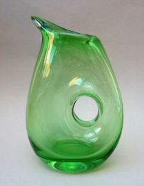 Hand blown green glass pitcher with hole