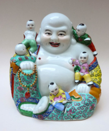 Large Chinese porcelain sitting Budai with five playing boys