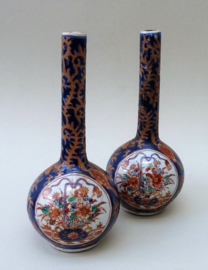 A pair of vintage small Imari porcelain bottle vases