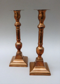 A pair of 19th century Flemish red copper neo classical candlesticks
