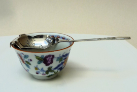 English Art Deco silver plated tea strainer