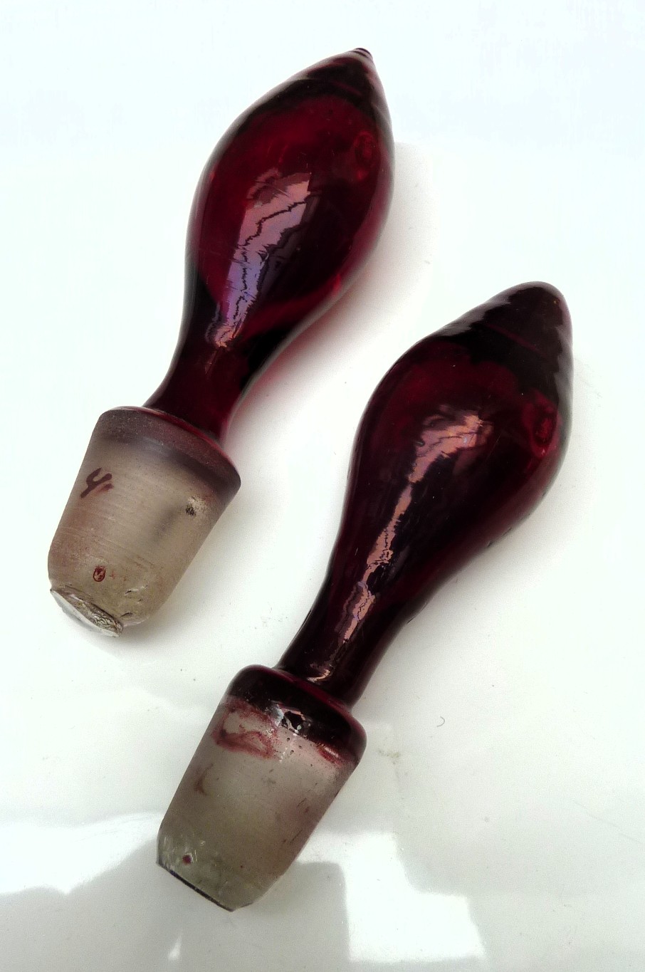 A pair of Bohemian ruby red glass bottle decanters late 19th century