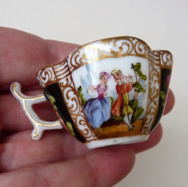 A pair of Dresden miniature  quatrefoil cups 19th century