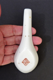 Chinese red porcelain spoon with blossom
