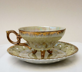 Lusterware tea cup with feet and reticulated saucer