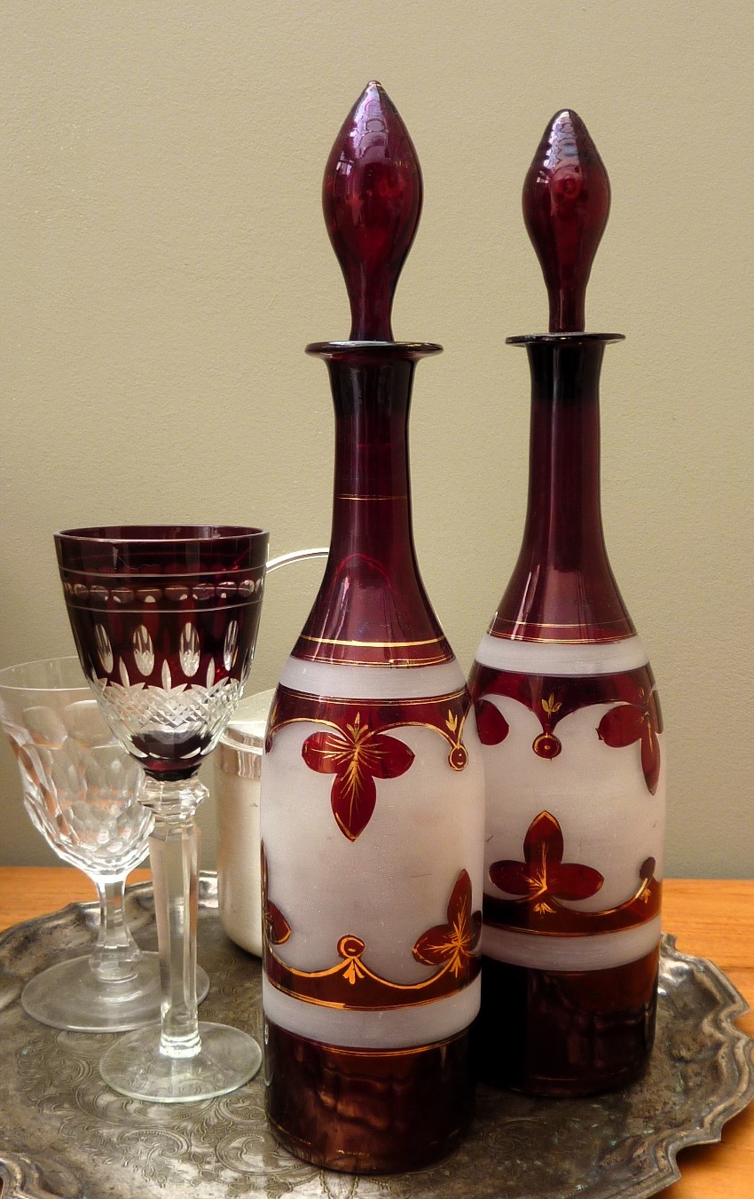 A pair of Bohemian ruby red glass bottle decanters late 19th century