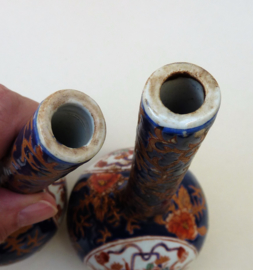 A pair of vintage small Imari porcelain bottle vases