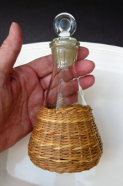 Mid Century oil and vinegar bottles in wicker baskets