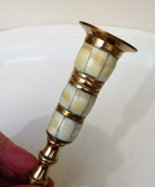 A pair of brass and mother of pearl candlesticks