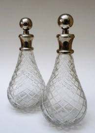 A pair of diamond cut crystal decanters